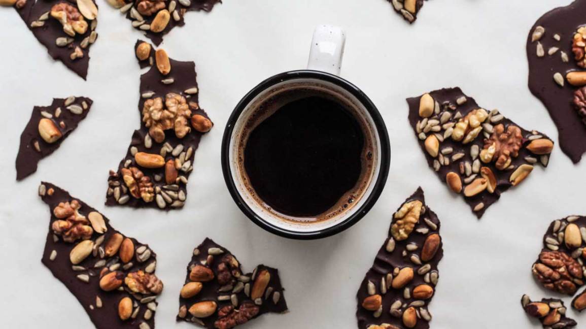 coffee in a mug surrounded by chocolate bark